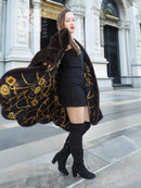 Dark brown mink swing coat with gold baroque lining visible at open side