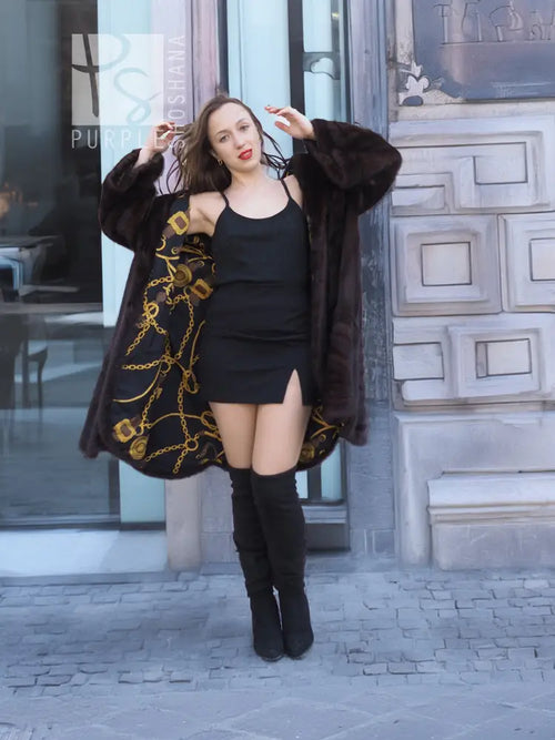 Dark mink swing coat with gold baroque lining trim, open front, long sleeves