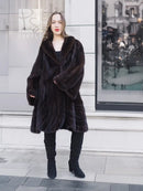 Mink swing coat with dark plush fur, hooded V-neck and wide swing panels over leggings