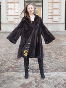 Dark mink swing coat with gold baroque lining, voluminous sleeves, open front