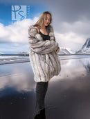 Long faux fur jacket with high collar and vertical textured pattern, side view