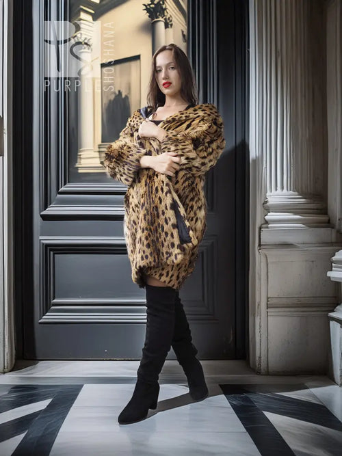 Faux fur leopard-pattern coat with plush texture, open front and long sleeves