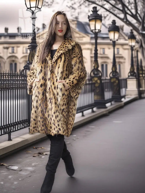 Hooded animal-print fur coat, tan with dark leopard spots, longline silhouette