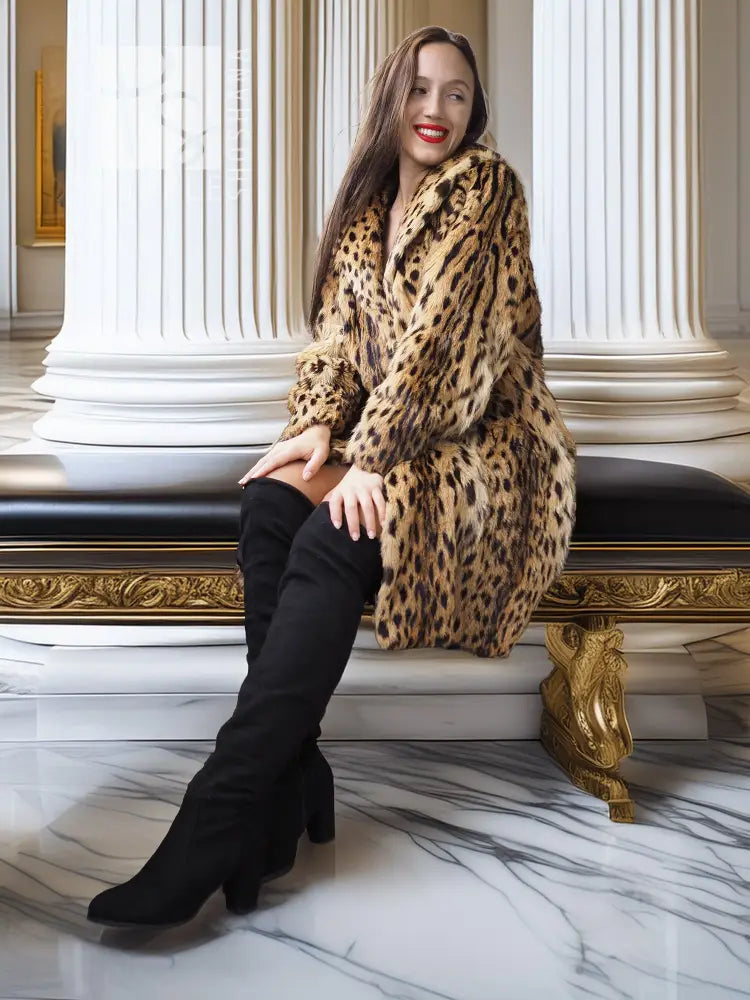 Hooded leopard-spotted fur coat, tan with dark spots, longline silhouette