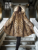 Faux fur coat with leopard spots, long sleeves, hoodless open front, tan and dark brown