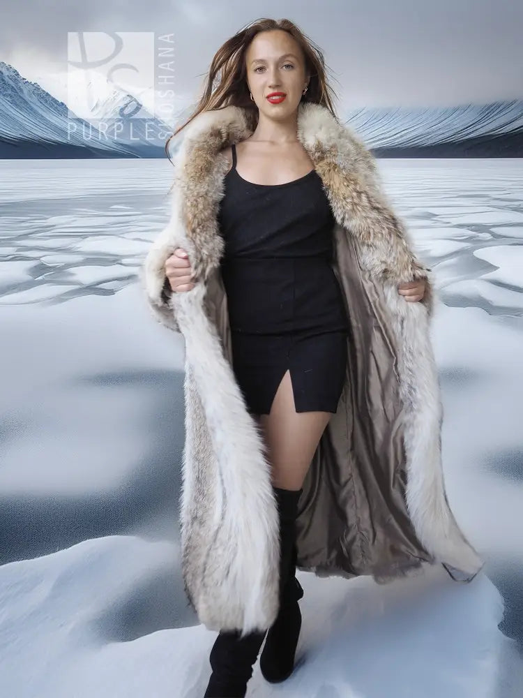 Long coyote fur coat with white accents over a black slip dress and boots