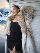 Coyote fur coat with white fur trim and oversized shoulders, side view