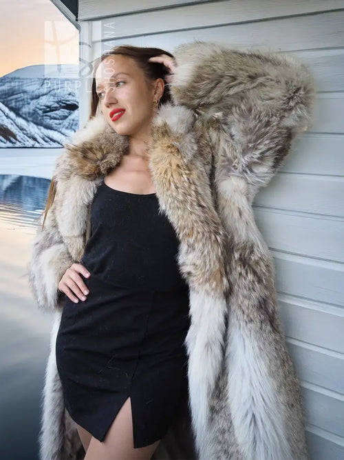 Coyote fur coat with white fur trim and oversized shoulders, side view