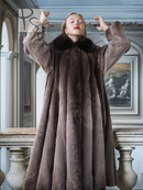 Women’s full-length dark brown beaver coat with wide collar and vertical panel texture