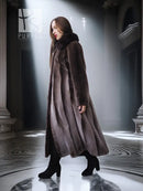 Women’s long dark brown beaver coat with dramatic collar, relaxed fit and flared hem