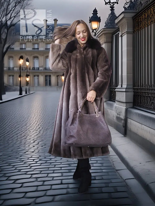 Beaver fur full-length coat with flared hem and dramatic collar; walking and holding bag