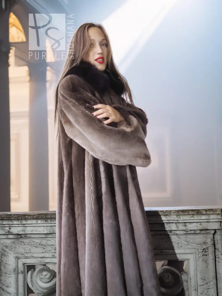 Dark brown full-length coat with thick collar and gently flared, straight front