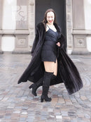Black mink fur sweep coat with flowing hem and open front, worn with gloves