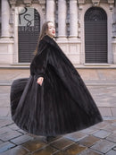 Black mink sweep coat with belted waist, voluminous skirt, and fur collar