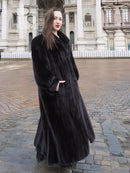 Black mink full-length coat with textured fur finish and angled front view