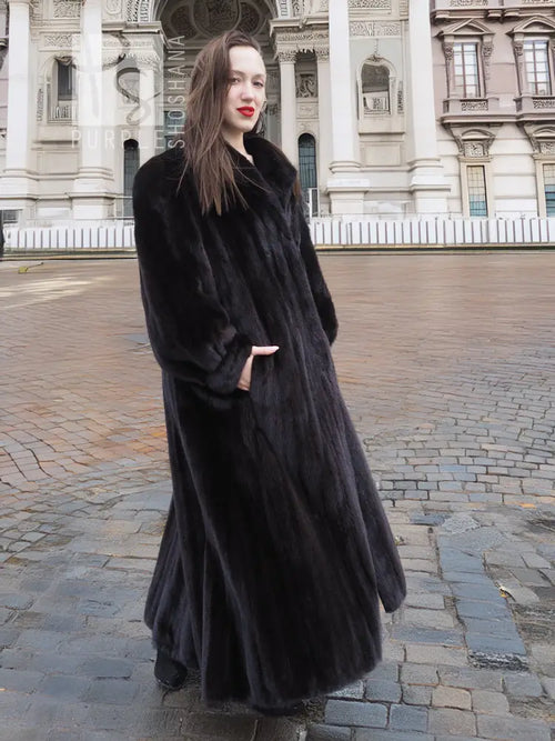 Black mink full-length coat with textured fur finish and angled front view