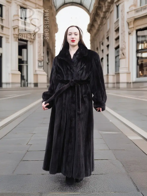 Black mink fur sweep coat with wide collar and belt tie, full-length sleeves
