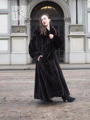 Black mink sweep coat with deep cuffs and skirt-length silhouette
