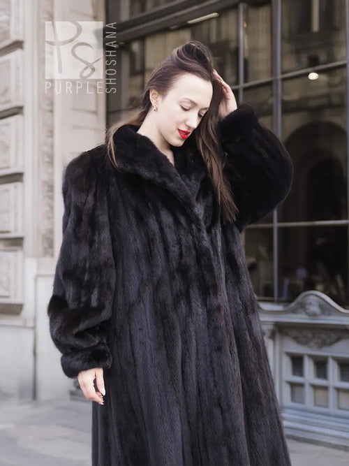 Black mink textured coat with wide fur collar and long sleeves