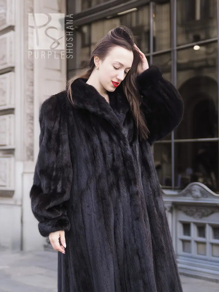 Black mink textured coat with wide fur collar and long sleeves