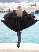 Black mink swing coat, back view, wide flared silhouette with long sleeves