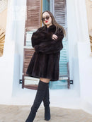 Black mink swing coat with wide, voluminous sleeves