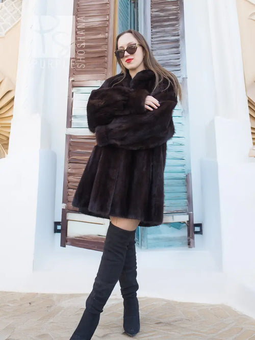 Black mink swing coat with wide, voluminous sleeves