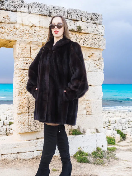 Black mink swing jacket coat with standing collar and button detail, front view
