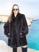 Black mink swing jacket coat with button front, wide collar, and long puff sleeves