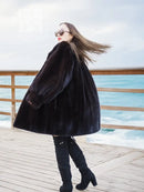 Black mink swing coat with structured shoulders and wide sleeves
