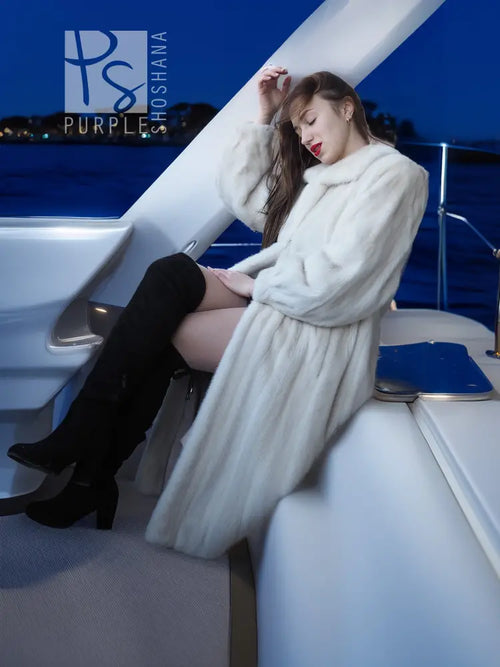 Ivory mink fur coat with shawl collar, long sleeves, belted waist, full length