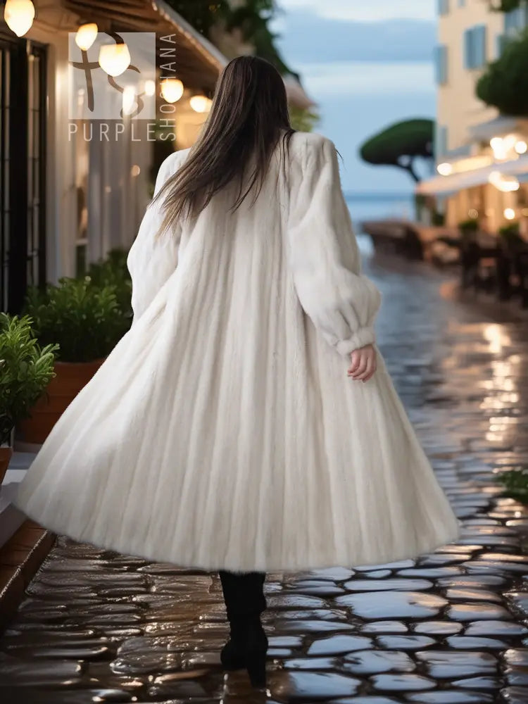 Back view of an ivory mink fur coat with wide skirt silhouette and long sleeves