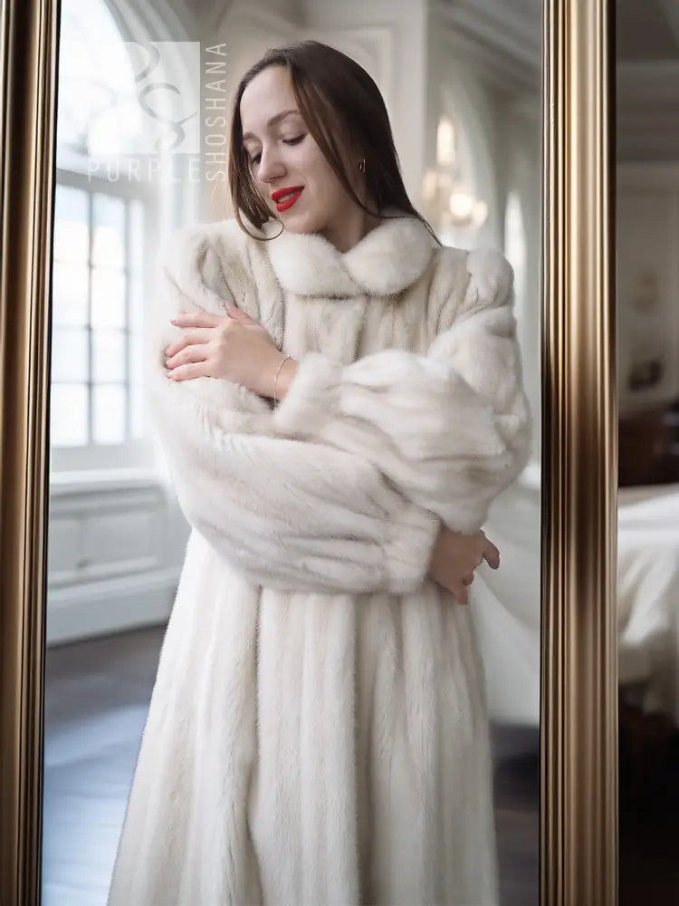 Ivory mink fur coat with thick collar and chunky fur cuffs