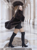 Vintage mink swing coat in dark brown, three-quarter view with oversized sleeve volume