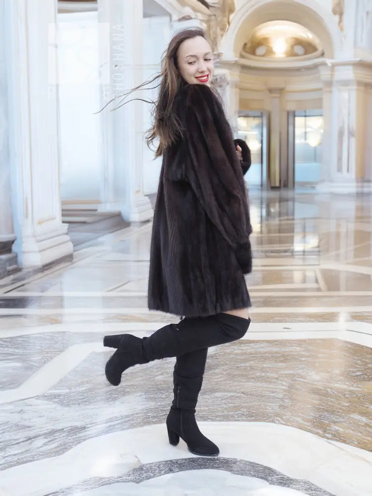 Dark vintage mink swing coat with high collar and long sleeves, flared swing hem and cuffs.