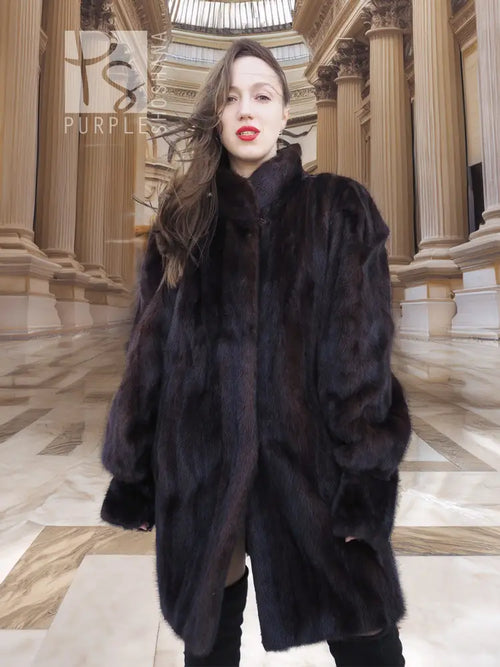 Dark vintage mink swing coat with high collar, long sleeves, plush fur texture, front button.