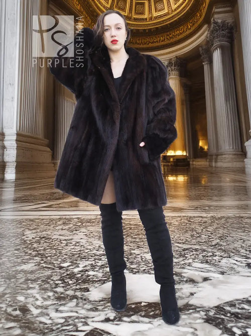 Vintage mink swing coat with high collar, wide sleeves, dark fur texture, front button.