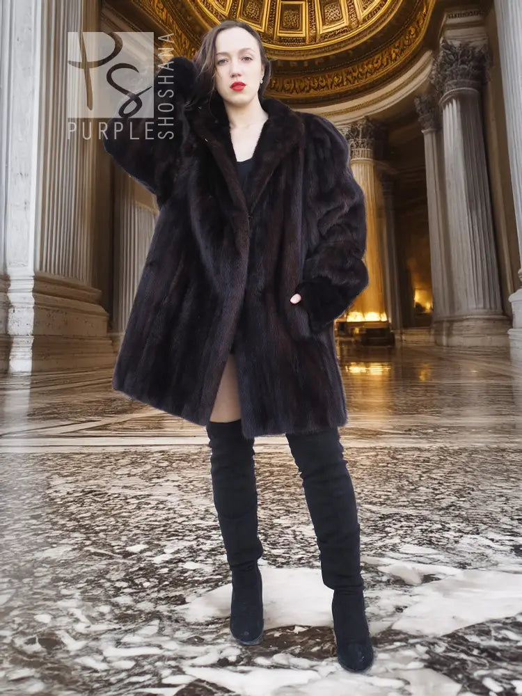 Vintage mink swing coat with high collar, wide sleeves, dark fur texture, front button.