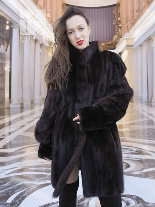 Vintage mink swing coat with high collar, long sleeves, dark fur texture, front button.