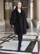 Vintage mink swing coat with stand collar, long sleeves, dark fur, side slit hem.