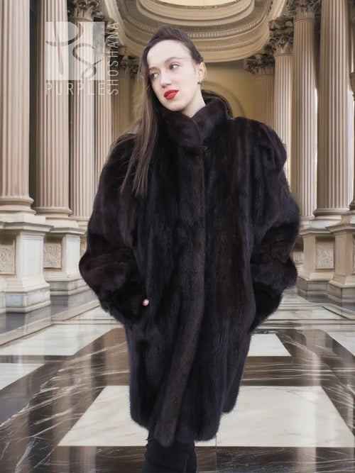 Dark vintage mink swing coat with high stand collar and long sleeves, front button closure.