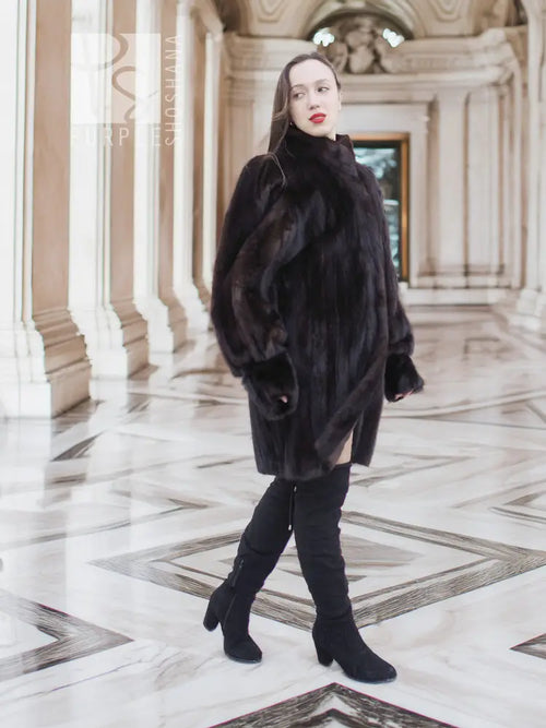 Vintage mink swing coat with high collar, long sleeves, dark fur, straight swing silhouette.