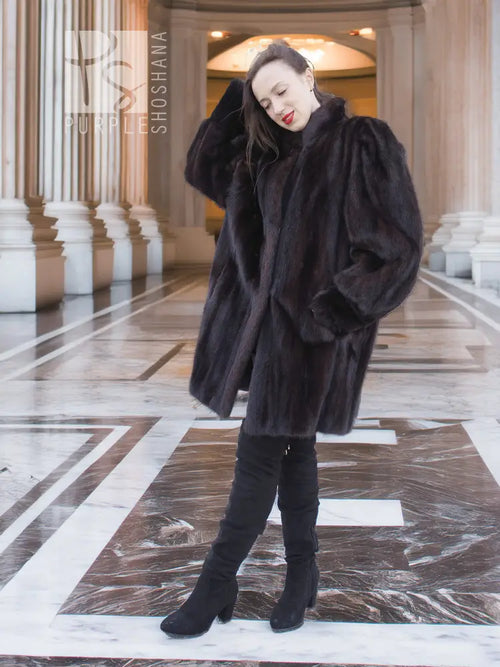 Vintage mink swing coat in dark brown, front view with rounded cuffs and swing shape