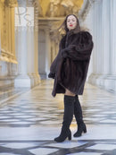 Vintage mink swing coat in dark brown, walking view with puff sleeves and A-line shape
