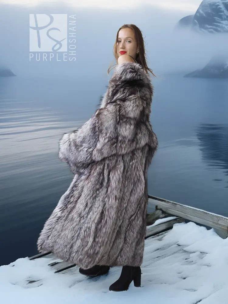 Long silver fox fur coat with wide sleeves and gray-and-white speckled pattern, standing