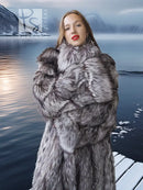 Silver fox fur coat with layered collar and dense fur texture, gray-and-white pattern