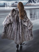 Gray faux fur long coat viewed from the back, with wide collar and long sleeves.