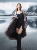Gray faux fur wrap or stole with long sleeves, draped over shoulders and arms.