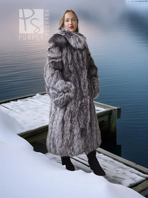 Long silver fox fur coat with full sleeves and gray-and-white striped pattern, side view