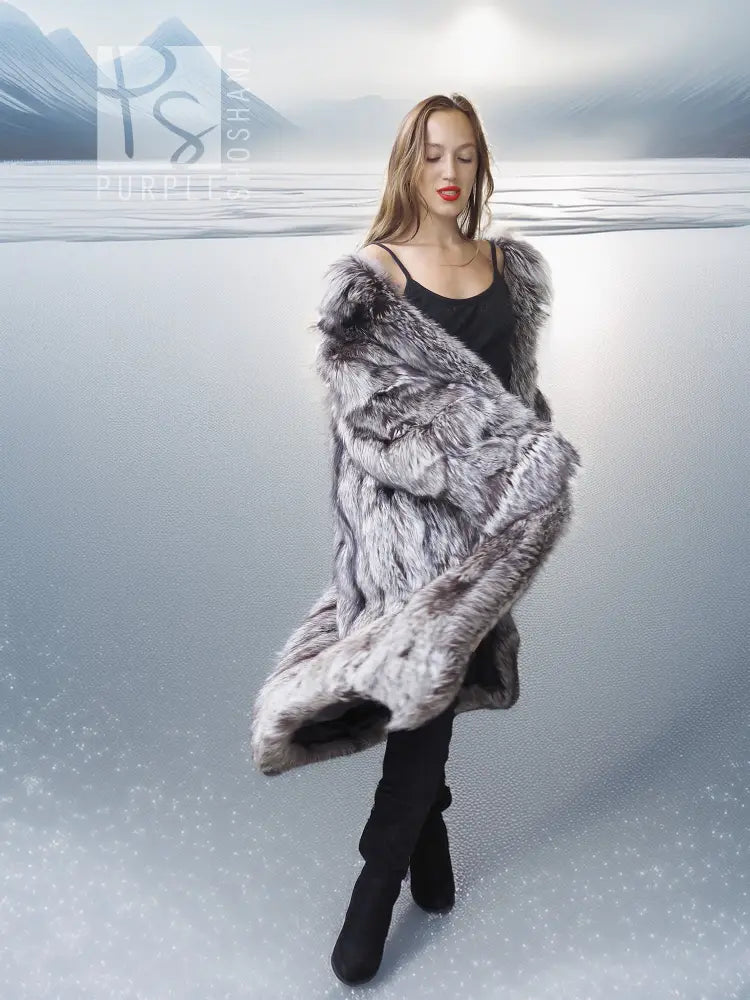 Gray faux fur wrap or stole with long sleeves, worn over a black mini dress.